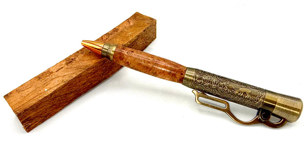 Hand-turned burl teakwood pen by STICS and STONES, featuring a smooth, polished surface and elegant design.
