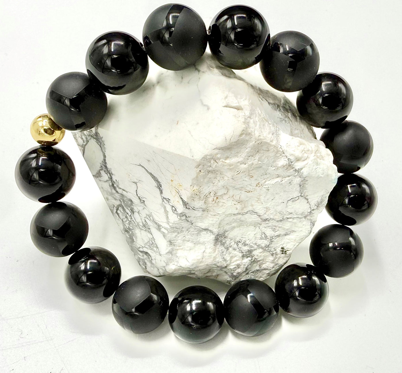 Onyx matte and polished bracelet from STICS and STONES featuring smooth black onyx beads and stylish design.