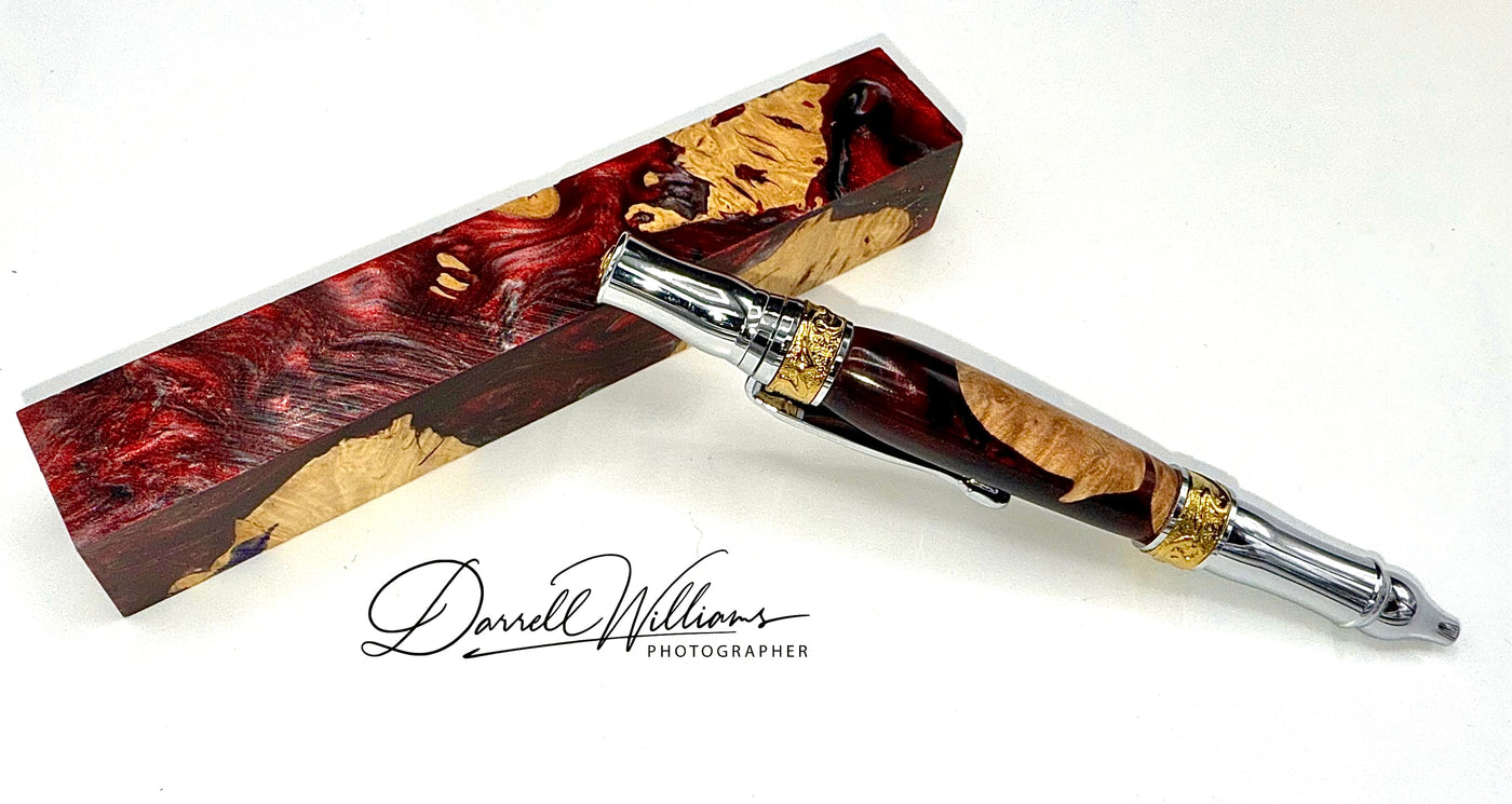 Hand-turned Burgundy acrylic and wood pen by STICS and STONES, showcasing a sleek, elegant writing instrument with a polished finish.