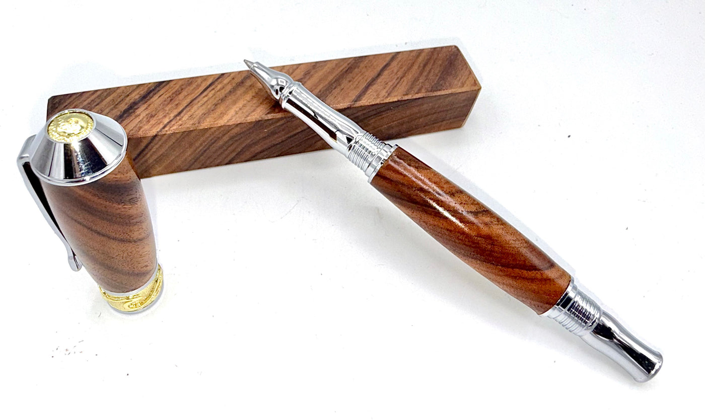 Hand-turned Brazilian Rosewood pen by STICS and STONES, showcasing smooth polished wood and elegant design.