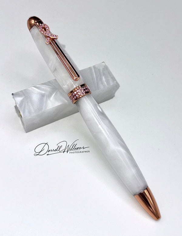 Hand-turned white acrylic and crystal breast cancer awareness pen by STICS and STONES with elegant design and branding.