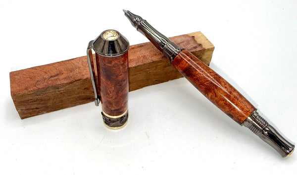 Hand-turned Moroccan Thuya Burl pen by STICS and STONES, showcasing a polished wooden pen with intricate grain details.