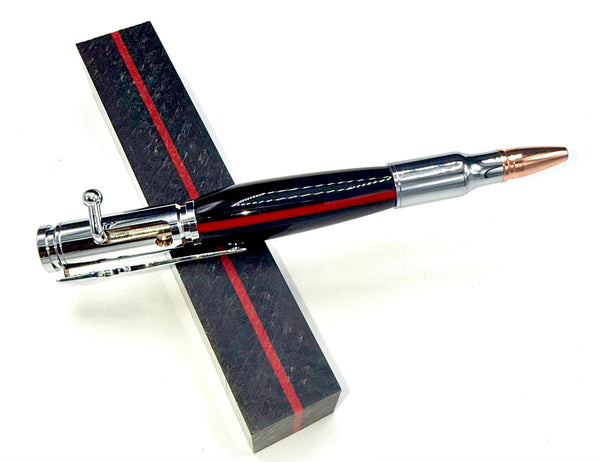 Hand-turned black and red firefighter bullet pen by STICS and STONES, featuring a sleek wood design and metal clip.